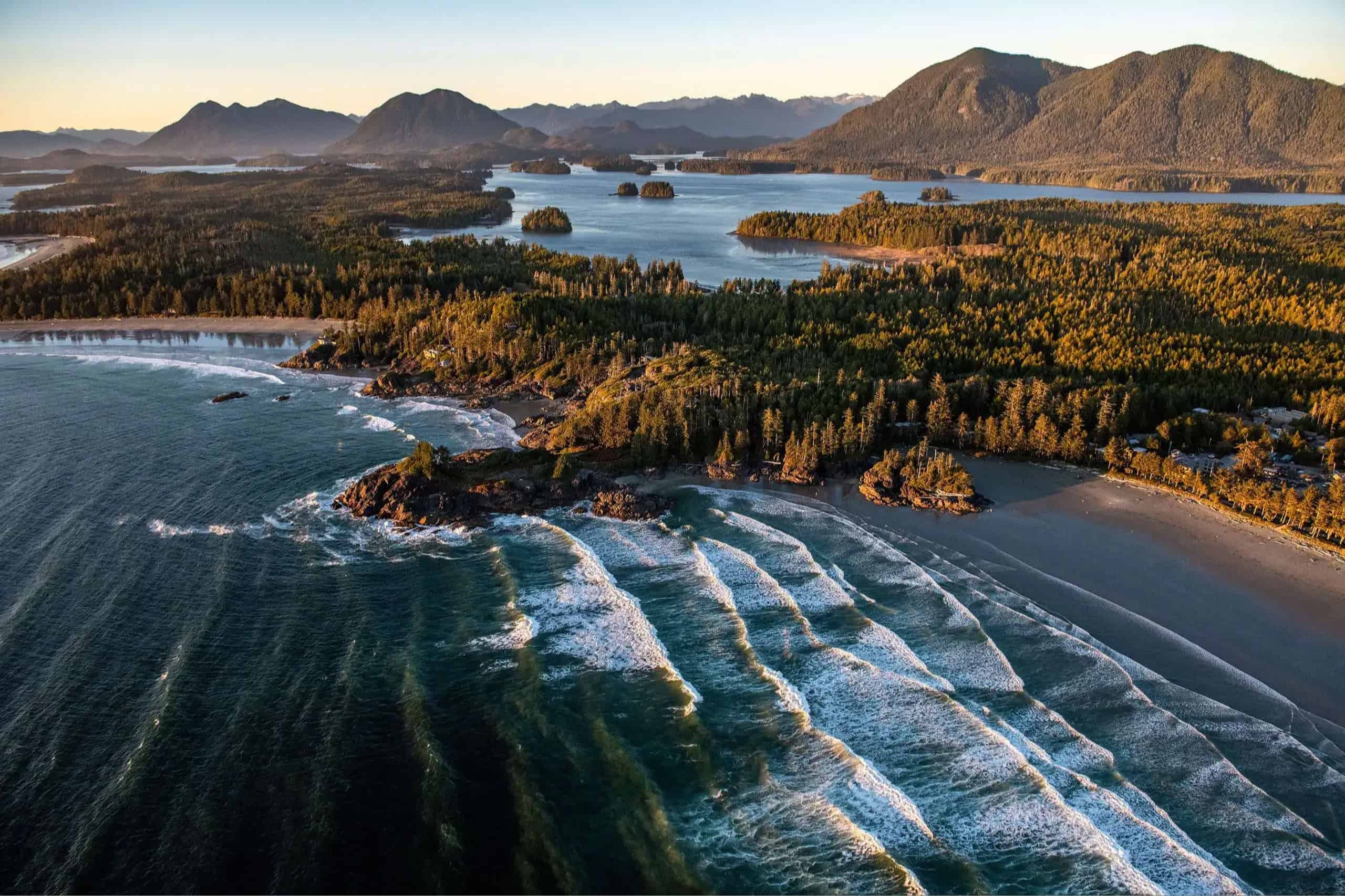 Aerial view of ocean and mountains.